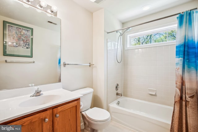 bathroom featuring visible vents, shower / bath combination with curtain, vanity, and toilet