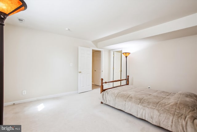 bedroom with visible vents, baseboards, and carpet flooring