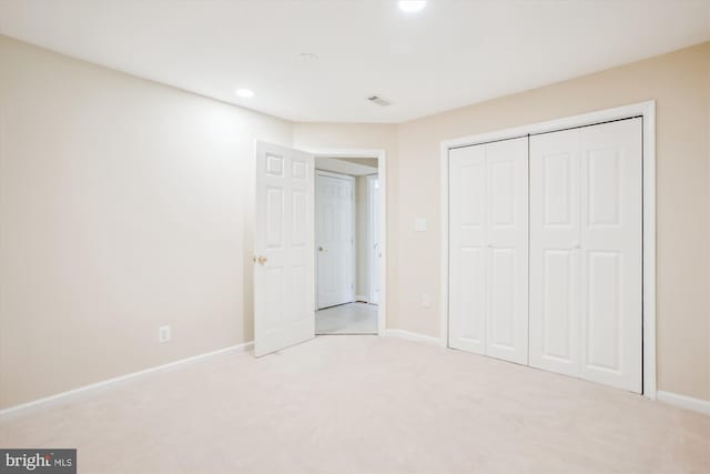 unfurnished bedroom with visible vents, baseboards, recessed lighting, a closet, and carpet floors