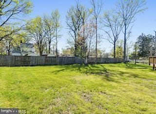 view of yard featuring fence