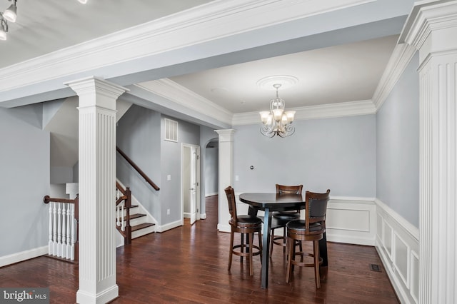 15343 Tewkesbury Pl, Upper Marlboro, MD 20774 - dining room with ornate columns, dark wood-type flooring, a chandelier, ornamental molding, and stairway