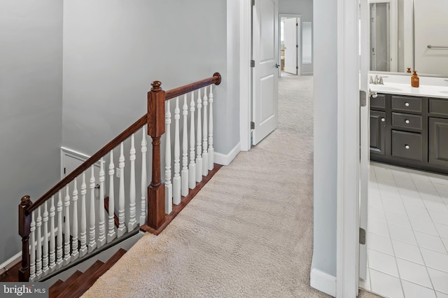 15343 Tewkesbury Pl, Upper Marlboro, MD 20774 - hallway with light colored carpet, a sink, an upstairs landing, and baseboards