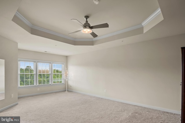 15343 Tewkesbury Pl, Upper Marlboro, MD 20774 - carpeted spare room featuring a tray ceiling, ornamental molding, baseboards, and a ceiling fan