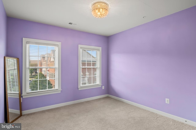 15343 Tewkesbury Pl, Upper Marlboro, MD 20774 - carpeted spare room with baseboards and a chandelier
