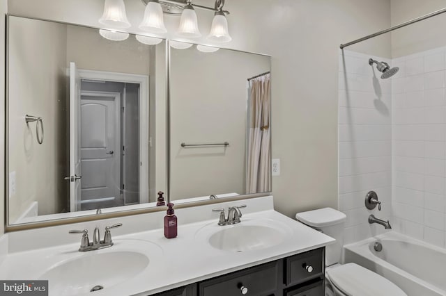 15343 Tewkesbury Pl, Upper Marlboro, MD 20774 - bathroom with double vanity, toilet, and shower / bath combo with shower curtain