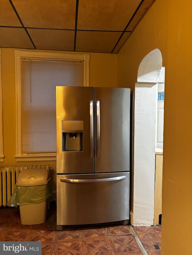 kitchen with stainless steel fridge with ice dispenser