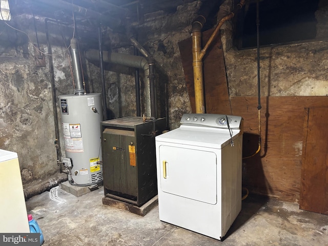 interior space featuring washer / dryer, heating unit, gas water heater, and laundry area