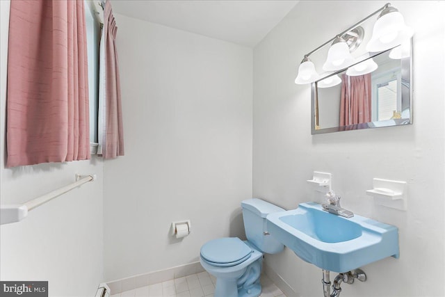3205 Sharon Ln, Norristown, PA 19403 - half bathroom with toilet, baseboards, and a sink