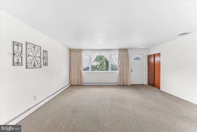 3205 Sharon Ln, Norristown, PA 19403 - unfurnished living room with baseboard heating, a baseboard radiator, light carpet, and visible vents