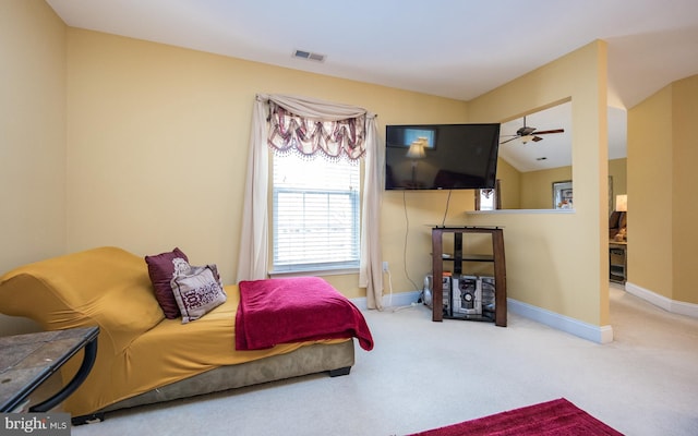 carpeted bedroom featuring visible vents, baseboards, and lofted ceiling
