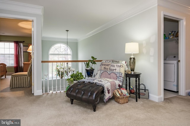 bedroom with carpet flooring, washer / dryer, baseboards, and crown molding