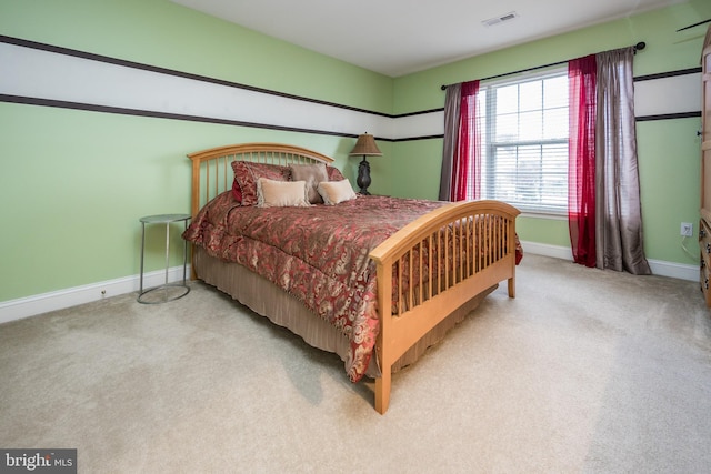 bedroom with visible vents, baseboards, and carpet floors