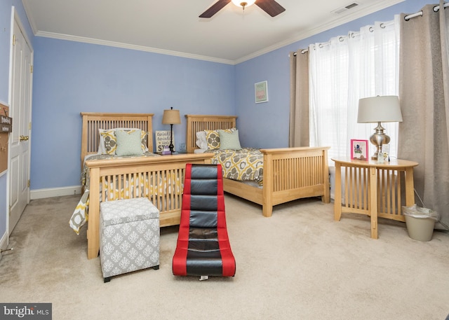 bedroom featuring ornamental molding, visible vents, and carpet floors