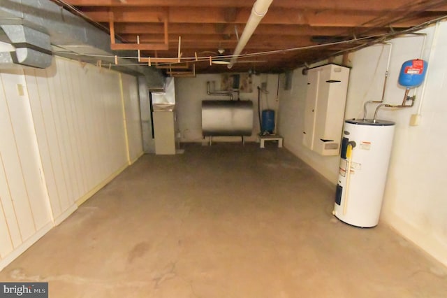 unfinished basement featuring water heater, heating fuel, and heating unit