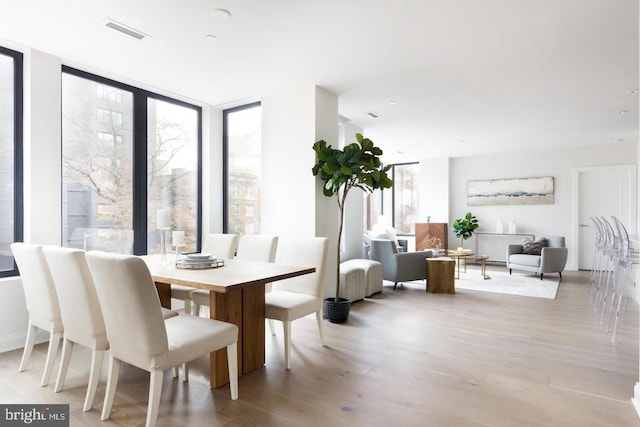 dining room with wood finished floors