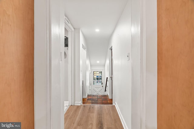 hall featuring recessed lighting and wood finished floors