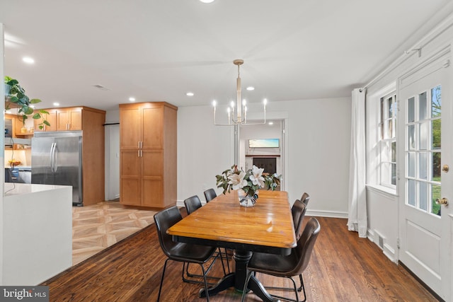dining room featuring recessed lighting, visible vents, wood finished floors, and a chandelier