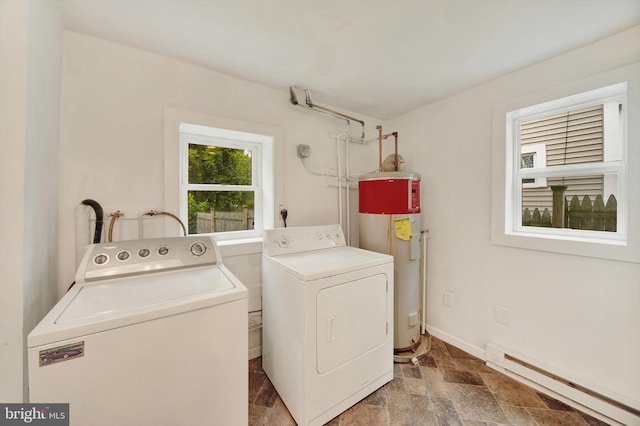415 Schwartz Ave, Baltimore, MD 21212 - laundry area with electric water heater, a baseboard radiator, washer and dryer, baseboards, and stone finish flooring
