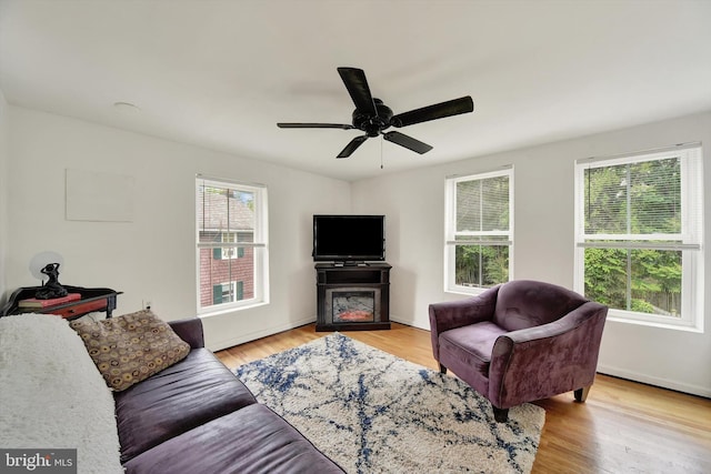 415 Schwartz Ave, Baltimore, MD 21212 - living area with light wood finished floors, ceiling fan, and baseboards