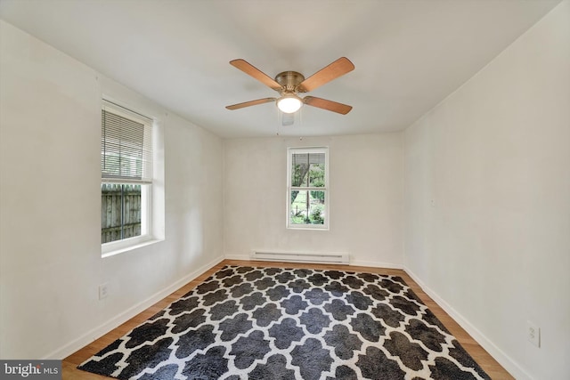 415 Schwartz Ave, Baltimore, MD 21212 - empty room featuring a baseboard radiator, wood finished floors, ceiling fan, and baseboards