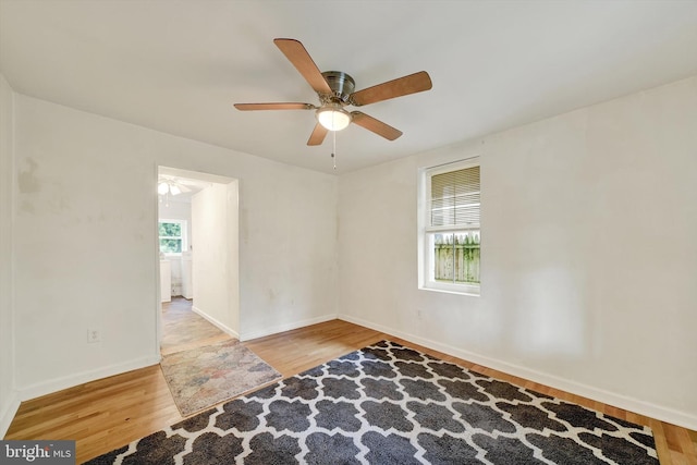 415 Schwartz Ave, Baltimore, MD 21212 - empty room with wood finished floors, ceiling fan, and baseboards