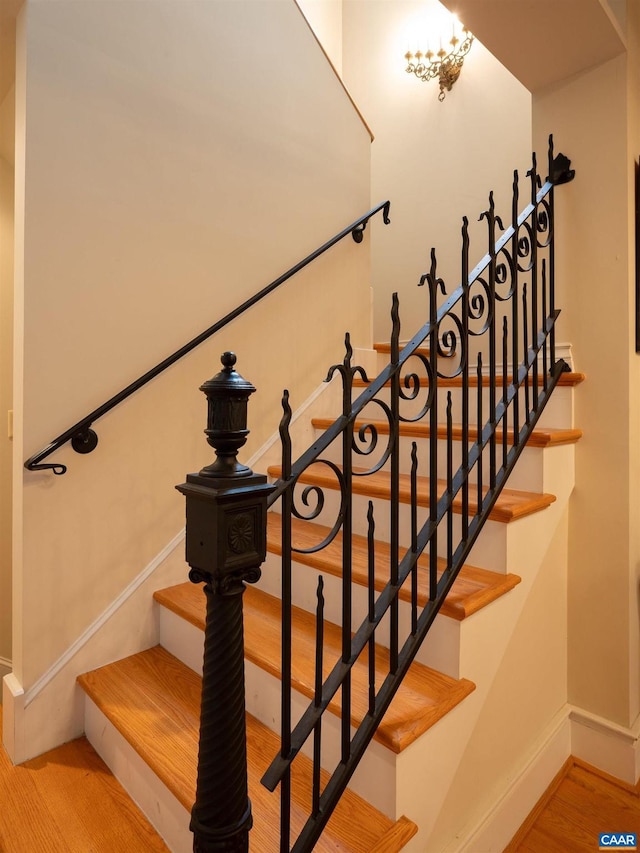 481 Stoney Creek E, Nellysford, VA 22958 - staircase with baseboards, arched walkways, and wood finished floors