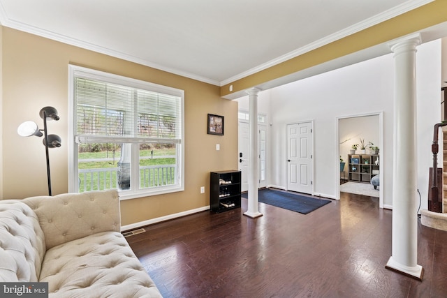 living area with dark wood-style floors, decorative columns, ornamental molding, and visible vents