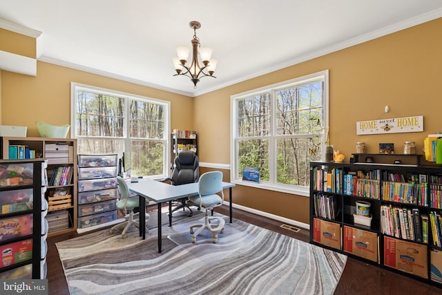 office area with a wealth of natural light, a notable chandelier, and crown molding