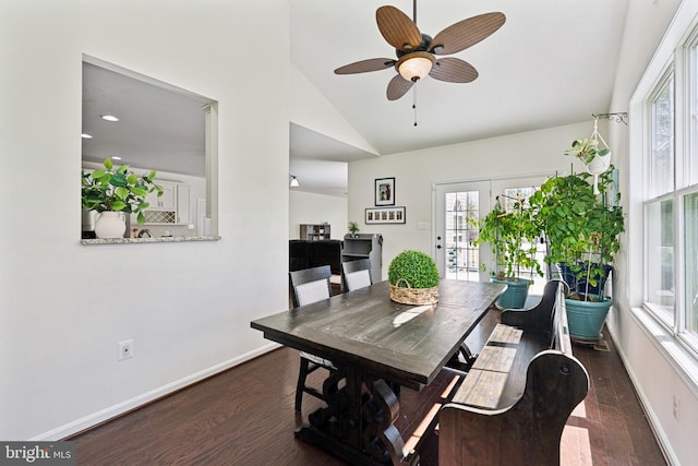 dining space with plenty of natural light, baseboards, and dark wood finished floors