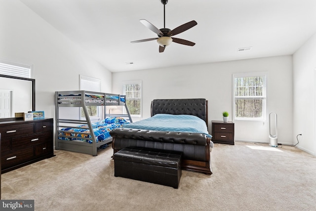 bedroom with visible vents, ceiling fan, and light colored carpet