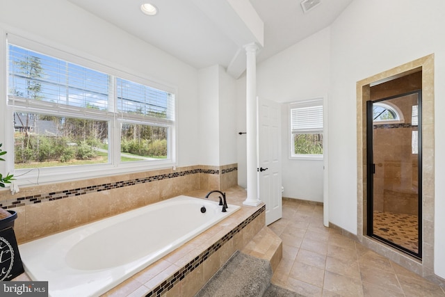 bathroom with visible vents, a stall shower, toilet, ornate columns, and a garden tub