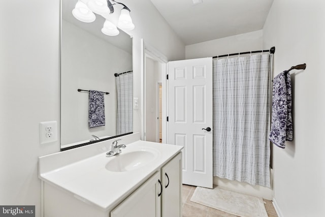 full bathroom with shower / tub combo, tile patterned flooring, and vanity
