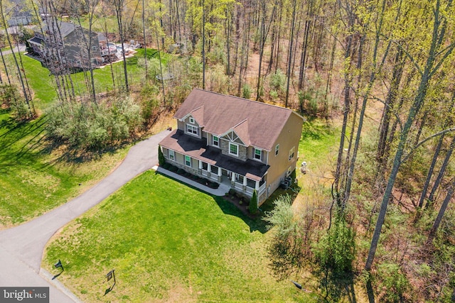 bird's eye view featuring a forest view