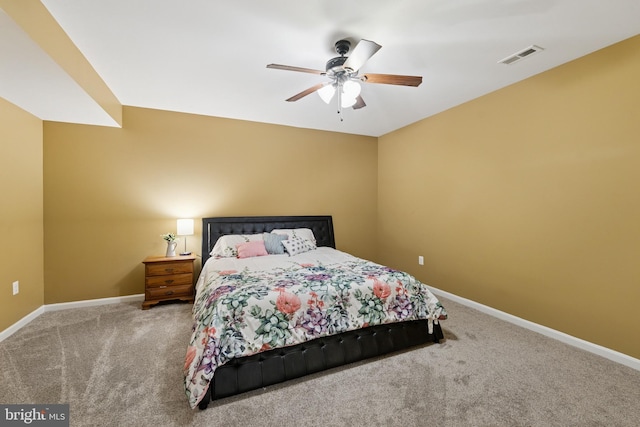 bedroom with visible vents, a ceiling fan, carpet flooring, and baseboards