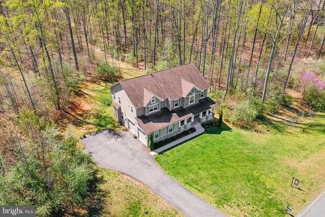 bird's eye view featuring a forest view
