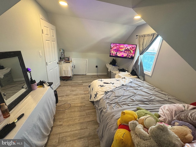 3207 Randall Rd, Suitland, MD 20746 - bedroom featuring recessed lighting, baseboards, vaulted ceiling, and wood finished floors