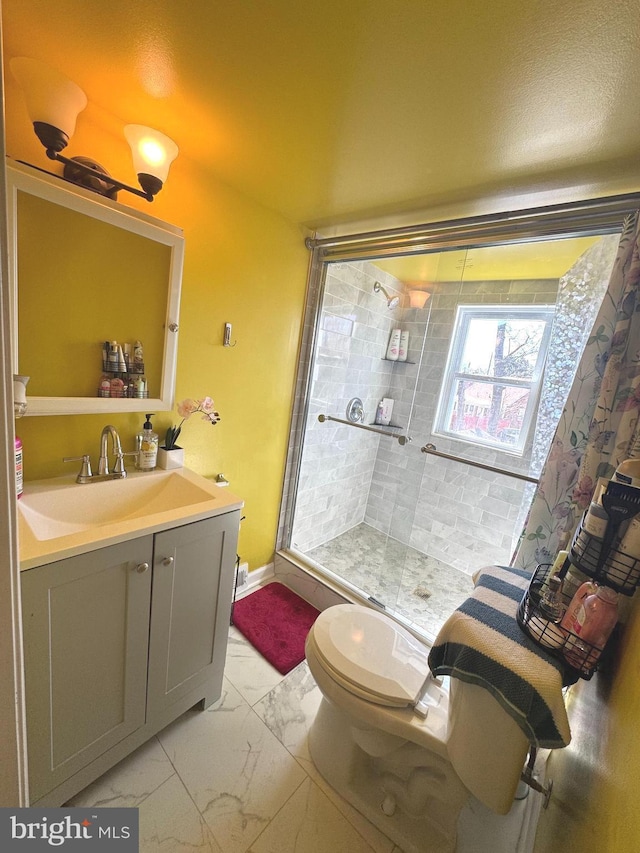 3207 Randall Rd, Suitland, MD 20746 - bathroom featuring vanity, marble finish floor, a stall shower, and toilet