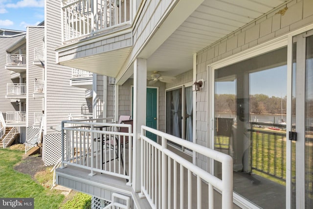 wooden terrace featuring a ceiling fan