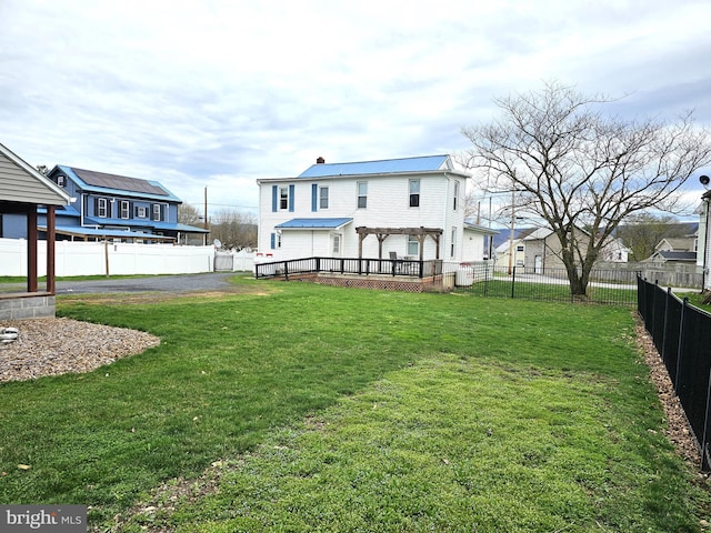 view of yard with a fenced backyard and a pergola