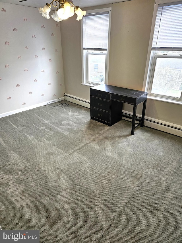 interior space featuring baseboards, a chandelier, carpet, and a baseboard radiator