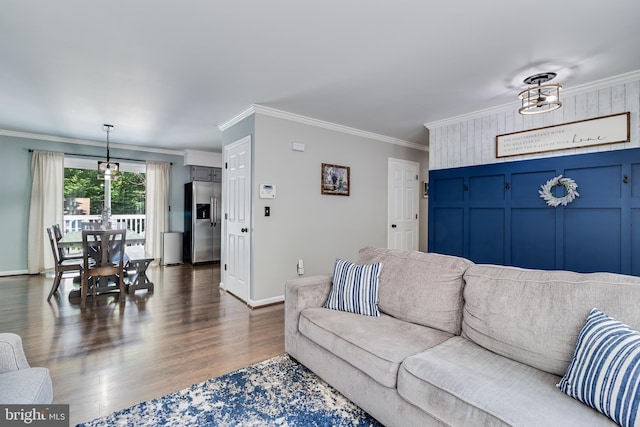 living room with crown molding, baseboards, and dark wood-type flooring