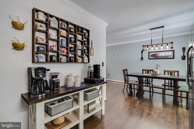 bar featuring baseboards, ornamental molding, and dark wood-style floors