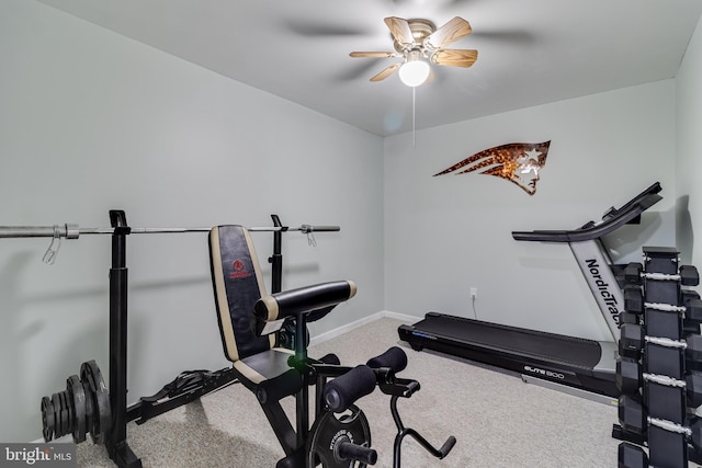 workout area featuring baseboards, carpet flooring, and ceiling fan