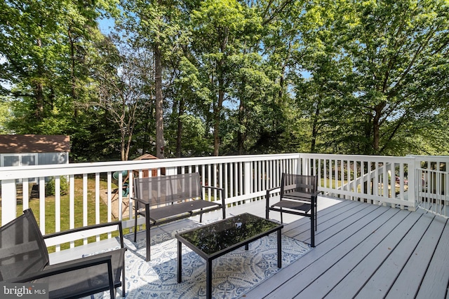wooden deck with outdoor lounge area