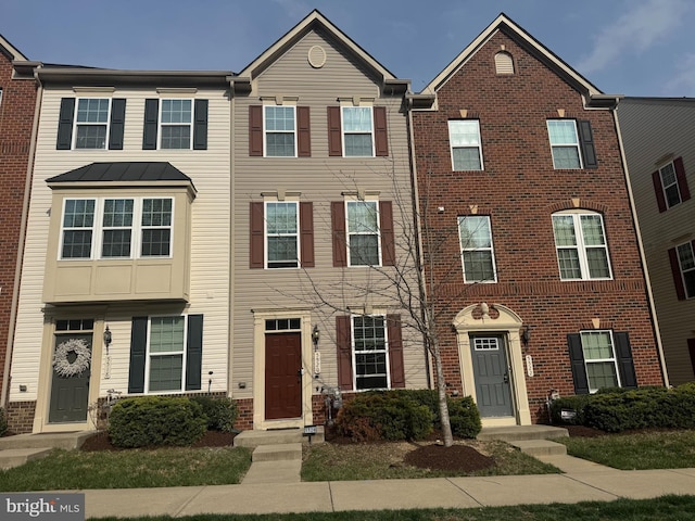 multi unit property featuring brick siding