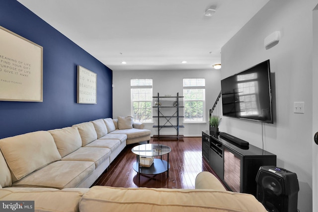 living room featuring hardwood / wood-style flooring, baseboards, and recessed lighting
