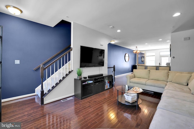 living room with visible vents, baseboards, recessed lighting, wood finished floors, and stairs