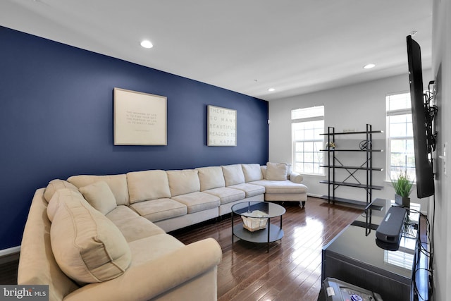 living area featuring baseboards, recessed lighting, and dark wood finished floors