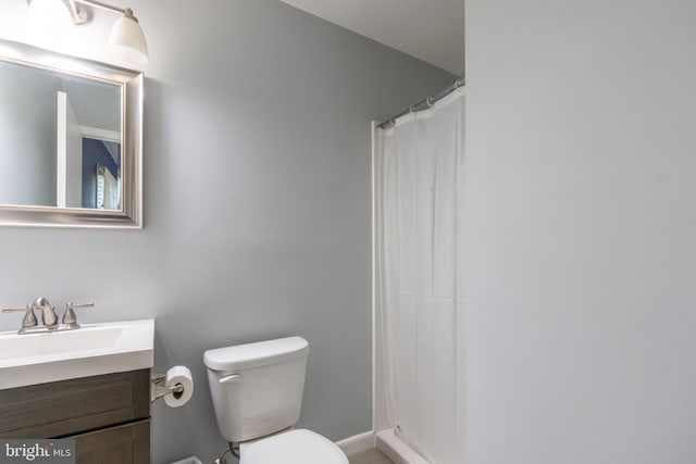 3305 Baker Ct, Altoona, PA 16602 - bathroom featuring vanity, toilet, baseboards, and curtained shower