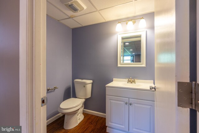 3305 Baker Ct, Altoona, PA 16602 - bathroom featuring toilet, wood finished floors, baseboards, a drop ceiling, and vanity